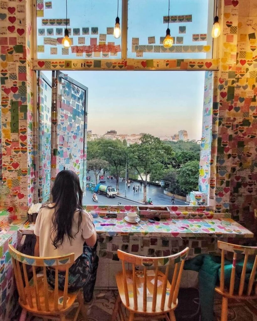 The Note Coffee in Hanoi is a unique destination adorned with colorful note papers hanging all around the cafe