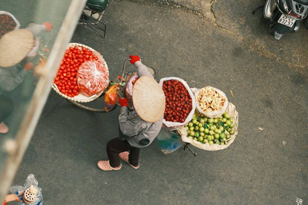 Vegetable sellers typically use the traditional pole with baskets hanging from both ends